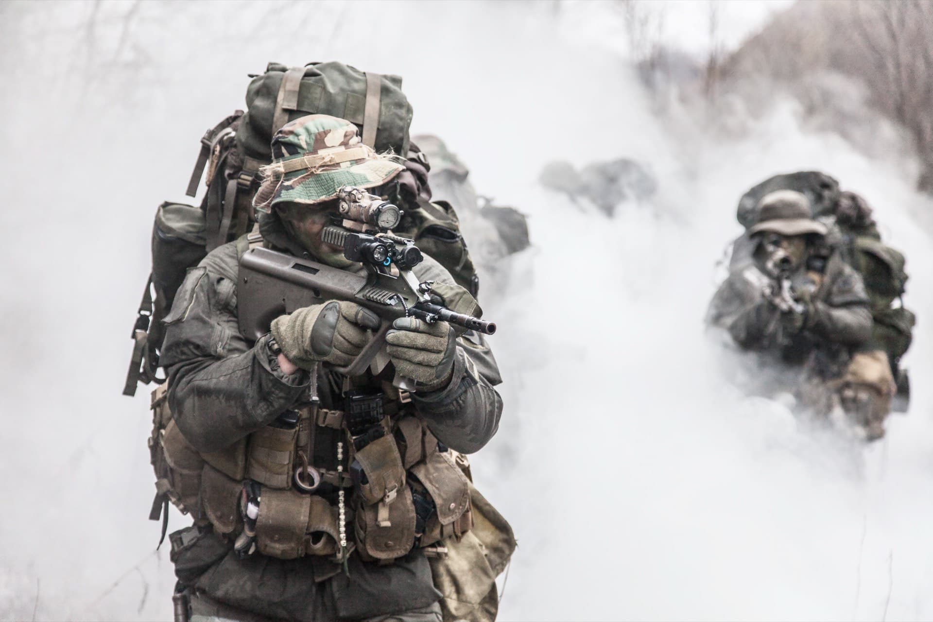 Personnel walking through smoke